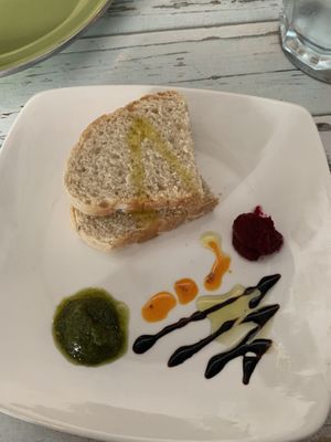 Complimentary bread. Beet, pesto, and something orange   at Veggitalia in Puerto Vallarta