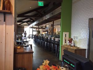 View of the 'food' bar area from the 'drinks' bar area at Greenleaf Gourmet Chop Shop - 17th St in Costa Mesa