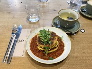 Corn fritters with smoky baked beans and avo smash  at Plants by Deliciously Ella in London