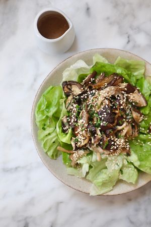 Seasonal mushroom and butter lettuce salad with sesame and chives + miso dressing on the side - yum too! at Plants by Deliciously Ella in London