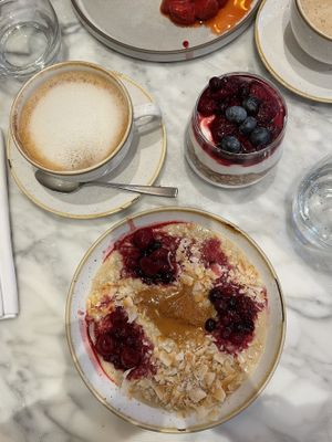 Creamy almond butter par Porridge + Coconut yoghurt topped with delicious Ella granola parfait + Almond cappuccino   at Plants by Deliciously Ella in London