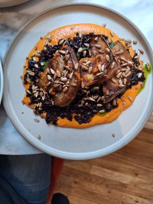 Best dish ever. Aubergine, black rice & red pepper cream. at Plants by Deliciously Ella in London