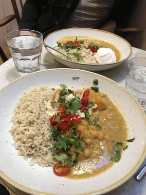 Sweet potato, pumpkin and chickpea curry with brown rice topped with coconut chips, chilli and coriander  at Plants by Deliciously Ella in London