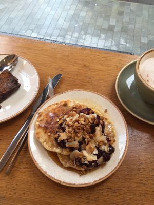 Pancakes + jam and maple syrup  at Plants by Deliciously Ella in London