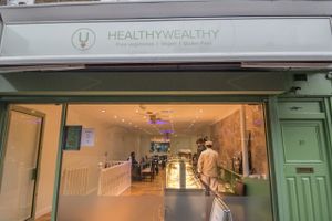 From outside the Restaurant shines with a Golden light and the food fragrance pervades the Street! at HealthyWealthy in North London