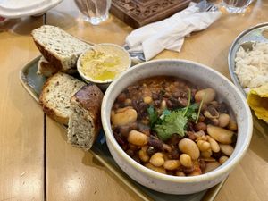 Bean stew with bread and hummus   at Santosa Wellness Centre Cafe in Edinburgh