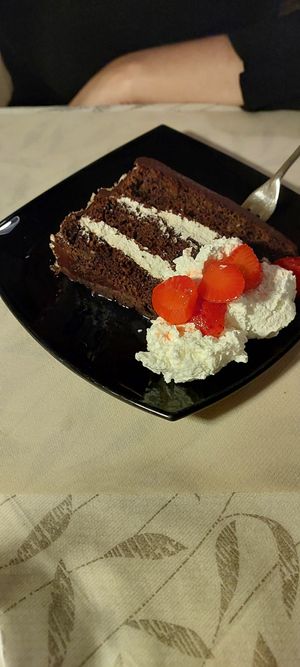 Three layer chocolate hazelnut cake at La Tecia Vegana in Venice