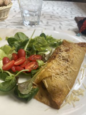 tortilla de harina de garbanzos rellena de setas y ensalada  at La Tecia Vegana in Venice