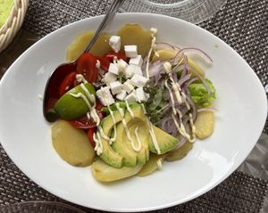  Salad : salad, tomatoes, vegan feta, avocado, red onion, baked potatoes.
Garnished with lime and mustard mayonnaise dressing (gluten free)  at La Tecia Vegana in Venice