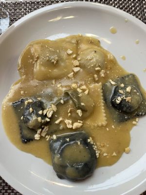 Ravioli (he il maileran and poreini mushrooms, Gamished with cashews.  at La Tecia Vegana in Venice