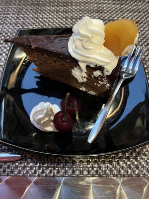 Traditional Austrian Chocolate Cake (Sacher) with Almond Cream, Fresh Cherries, and Dried Apricotts   at La Tecia Vegana in Venice