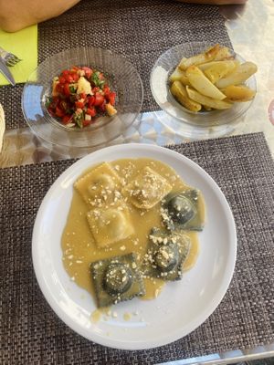 We got the side of potatoes (AMAZING!), the panzenela which was to die for, haven’t had tomatoes that were that fresh ever!! And lastly we got the ravioli which was very good.   at La Tecia Vegana in Venice