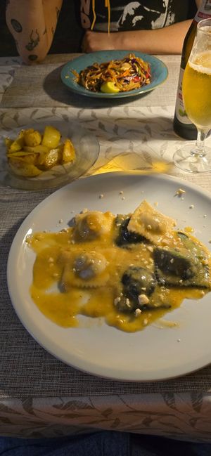 Ravioli and a side of roasted potatoes. at La Tecia Vegana in Venice