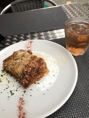 The delicious lasagna with a Spritz  at La Tecia Vegana in Venice