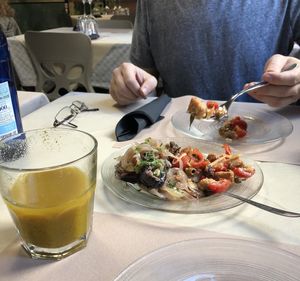 Panzanella and eggplant with onions starter and the “yellow” juice pineapple with turmeric, so good.  at La Tecia Vegana in Venice