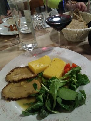 Roast Seitan with polenta and mixed greens at La Tecia Vegana in Venice