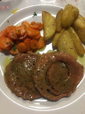 Homemade roast seitan with carrots and potatoes  at La Tecia Vegana in Venice