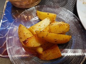 Baked potatoes with roast erbs at La Tecia Vegana in Venice
