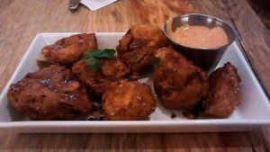 Artichoke nuggets with red pepper aioli. at The Arbor in Vancouver