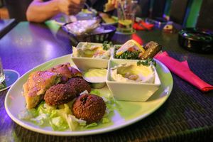 vegan plate - falafel with tahini sauce, hummus, baba ghanoush, stuffed vine leaves, tabbouleh, and pastries at Beirut SXM  in Simpson Bay