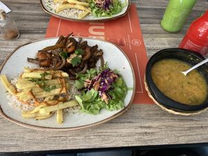 Seitan dish with soup and iced tea  at Mestizo Vegano in Bogota