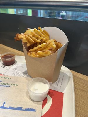 Waffle fries and vegan aioli   at AMS - LEON in Schiphol