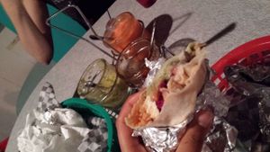 end of the burrito, with sauces to compliment at Budgies Burritos in Vancouver