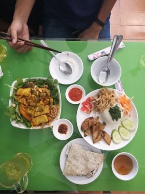 Crackers, turmeric noodles, green iced tea, broken rice with marinated tofu at Zen in Ho Chi Minh City