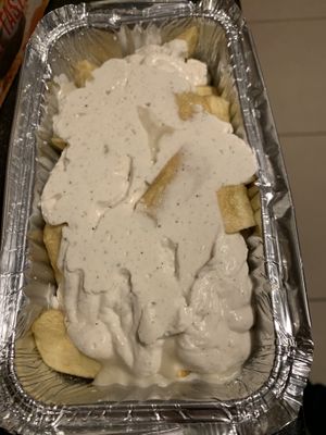 Garlic cheese chips   at McGuinness - Takeaway in Dublin