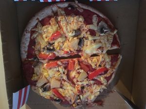 Gluten-free pizza with cheese, pineapple, mushrooms, corn, peppers  at McGuinness - Takeaway in Dublin