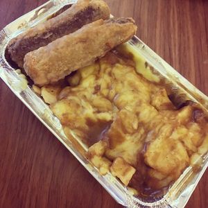 battered sausage and cheese fries at McGuinness - Takeaway in Dublin