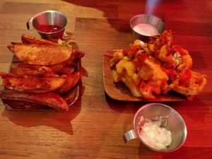 buffalo cauliflower wings and potato wedges at 90 Degree Melt in East London