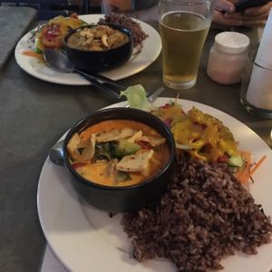 Red curry with a massive side of brown rice and salad at Cat House Chiang Mai - Cat Shack in Chiang Mai