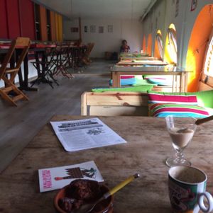 very chilled cafe lounge with low tables and seats as well as regular ones  at Le Bar a Vrac in Marseille