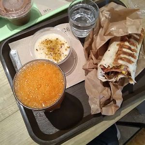 Farmer wrap, carrot ginger fresh pressed juice and Libanaise flan   at SAMAM - Cantine végétale in Paris