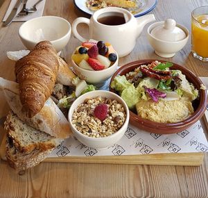 Vegan brunch (houmous, guacamole, taboulé, bread, fruits, chia raspberry pudding, croissant, tea, orange juice) at Le Pain Quotidien - Gran Via in Madrid
