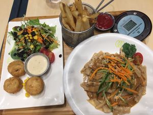 From left to right: crabless cakes, fries, sesame chicken noodles at Green Common - Harbour City in Kowloon