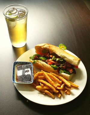 Sándwich Vietnamita "Banh Mi" 
Con cárnicas coloradas en un bagues te crujiente y tostadito at Shambhala in Mexicali