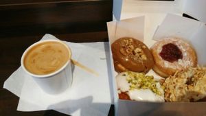 coffee with almond milk and a box of vegan donuts at The Rolling Donut - Bachelors Walk in Dublin