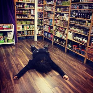 Measuring out shelf space  at Brontosaurus Vegan Lifestyle Store in Swansea