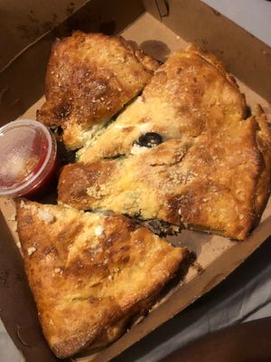Veggie calzone (Spinach, mushrooms, Roma tomatoes, seasoned ricotta, mozzarella, provolone and black olives) at Mellow Mushroom - Downtown in Montgomery