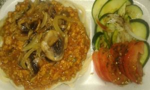 Vegan Bolognaise Sauce on Tagliatelle topped with Sauteed Mushrooms & Onions with a Green Side Salad at Vegan To Order in Windhoek