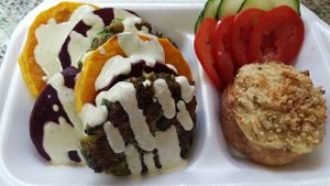 Roast Butternut & Beetroot Medallions, Zucchini Fritters drizzled with A Tangy Tahini Dressing and Crisp Whole Twice Baked Potatoes at Vegan To Order in Windhoek