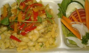Creamy Cashew Cheezy Macaroni with Peppers, Herbs and Peppadews served with a Green Side Salad. at Vegan To Order in Windhoek