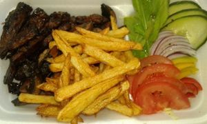 Smokey Grilled Vegan Beef strips, Portabello Mushrooms, French Fries & Green Salad. at Vegan To Order in Windhoek