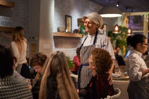 Divya Greeting Guests at Divya's Kitchen in New York City