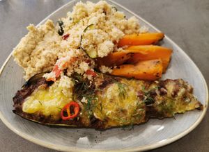 Meal of the day with filled zucchini, sweet potatoes, couscous and hummus at Nordvegan in Oslo