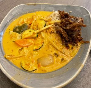 Curry rice bowl with fried oyster mushroom at Nordvegan in Oslo