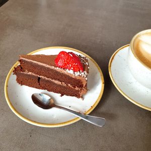 Vegan chocolate cake and oatmilk latte at Nordvegan in Oslo