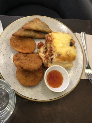 Lasagna, samosas, and sweet potato tempura  at Nordvegan in Oslo